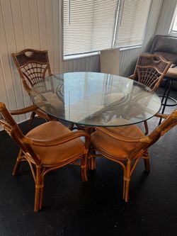 Glass table with four chairs