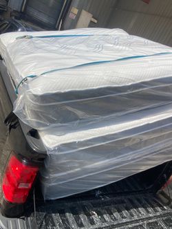 Queen pillowtop mattress and box spring new in plastic free delivery in Atlanta