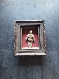 Vintage shadow box with clown.