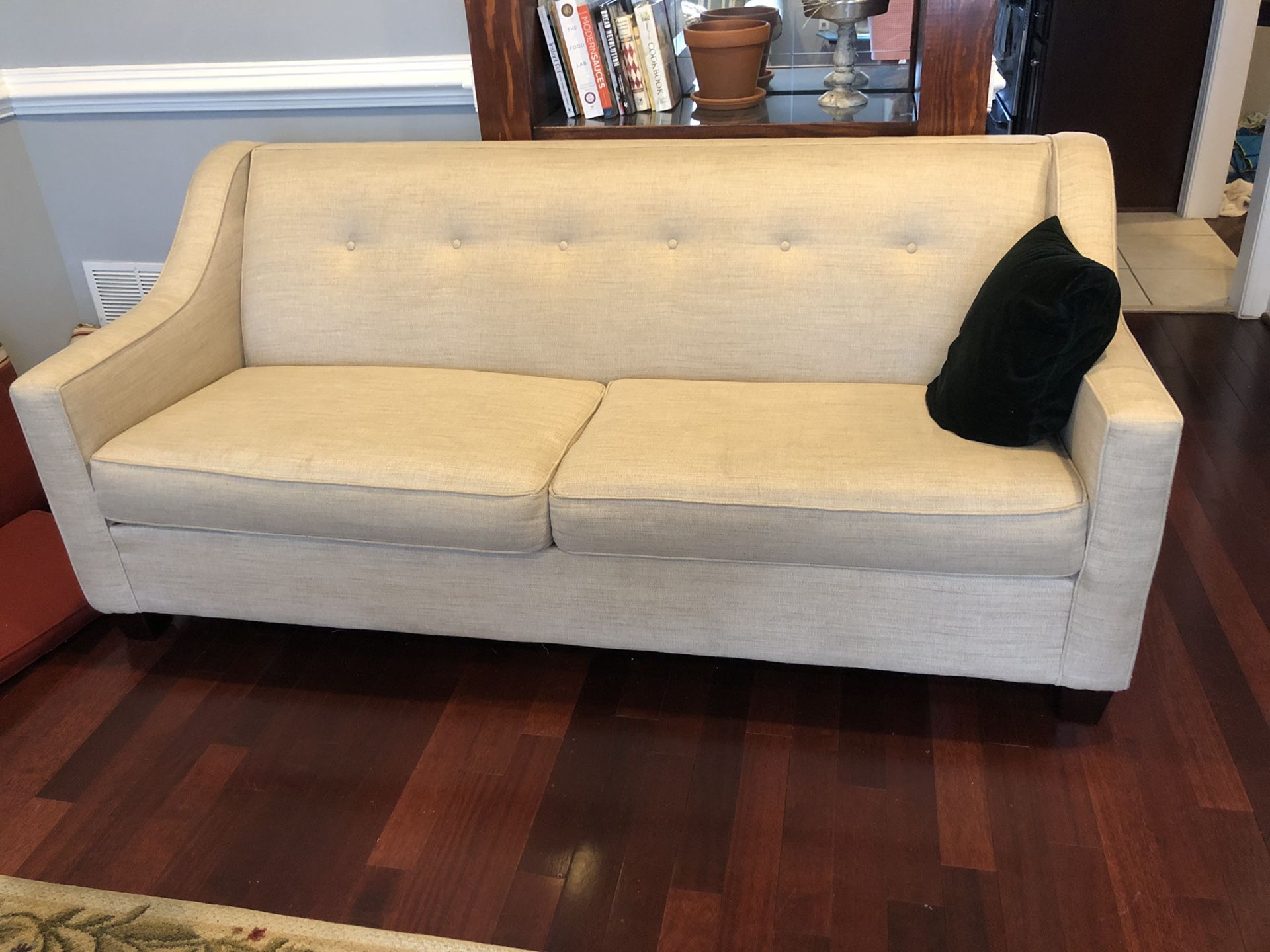 Cream sofa with full-sized pull out bed