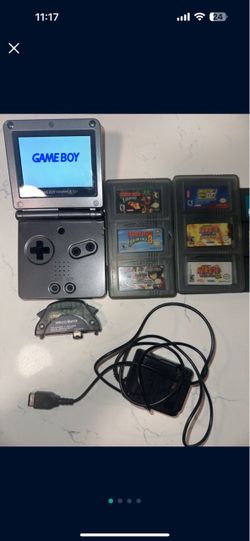 Gameboy Advance SP Graphite with 18 games, wireless adapter and 2 3 pack game cases