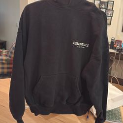 Essentials Sweat Shirt. 