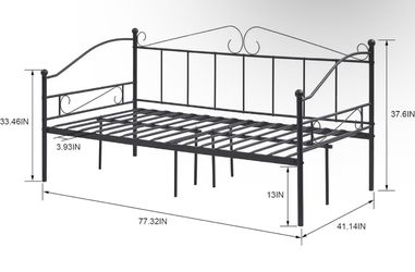 Black iron day bed with mattress and pillows