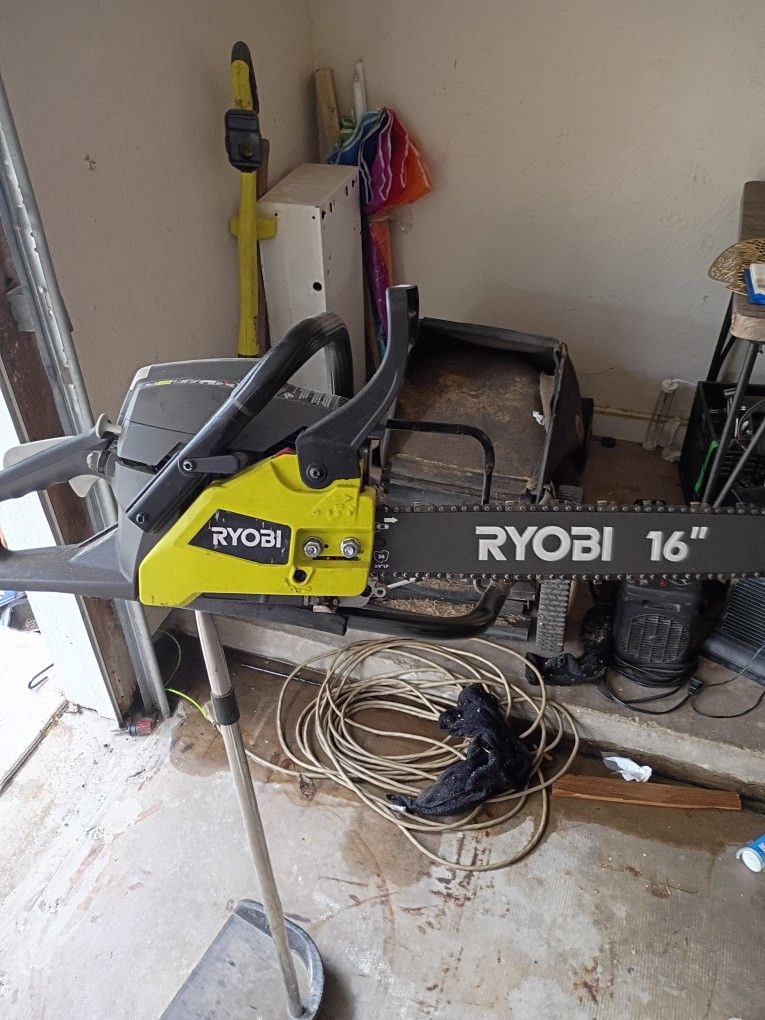 Chainsaw and Truck bed toolbox. Both In Perfect Condition