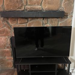 Hisense Smart TV with Black Entertainment Stand - Moving Sale