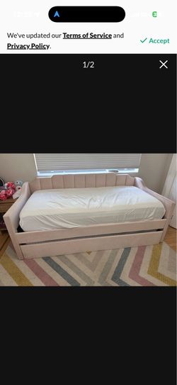 Twin pink upholstered daybed with trundle
