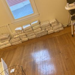 Two Packs Of Size 5 And 6 Diapers