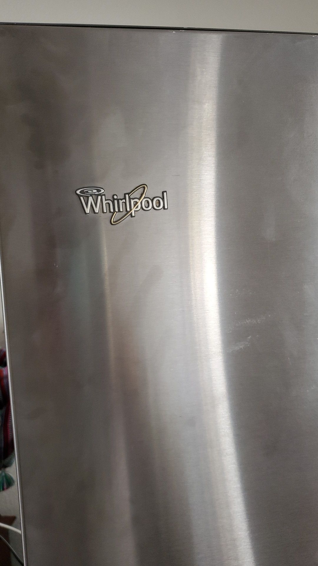 Whirlpool fridge almost new + but doesn't fit in a door need let it go