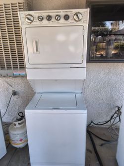 WHIRLPOOL WHITE STACKED WASHER AND GAS DRYER