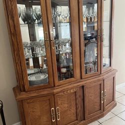 Glass cabinet and table with 8 chairs