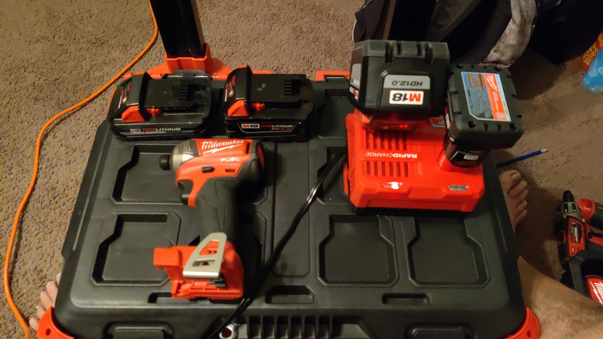 MILWAUKEE IMPACT SET. 3 BATTERIES AND RAPID CHARGER. WILL SELL THE PACKOUT BOX ALSO