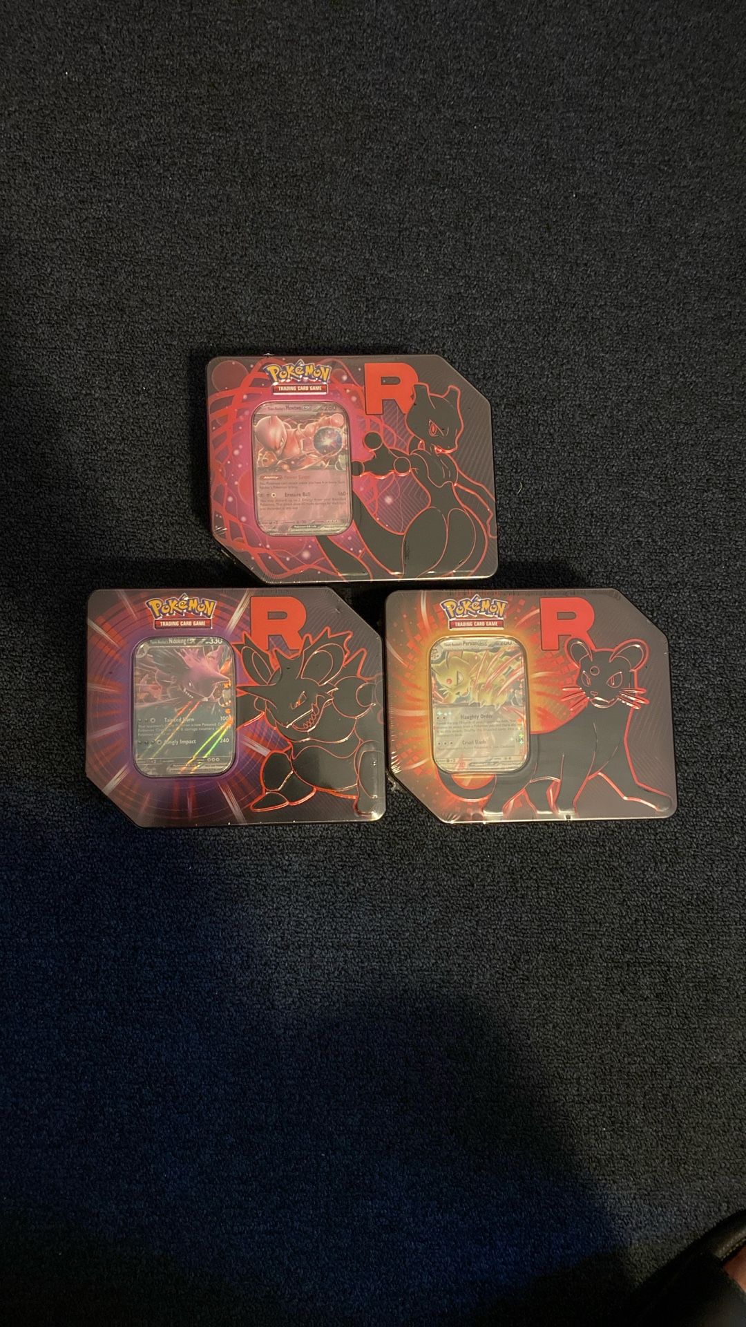 Team Rocket Tins