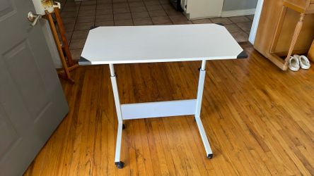 31.5 by 16 Rolling desk, adjustable height.
