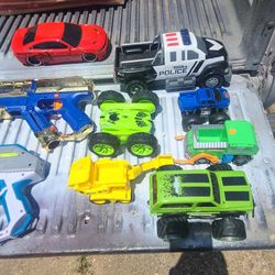 BOX OF KID'S TOY'S  (NERF GUNS & CARS ).