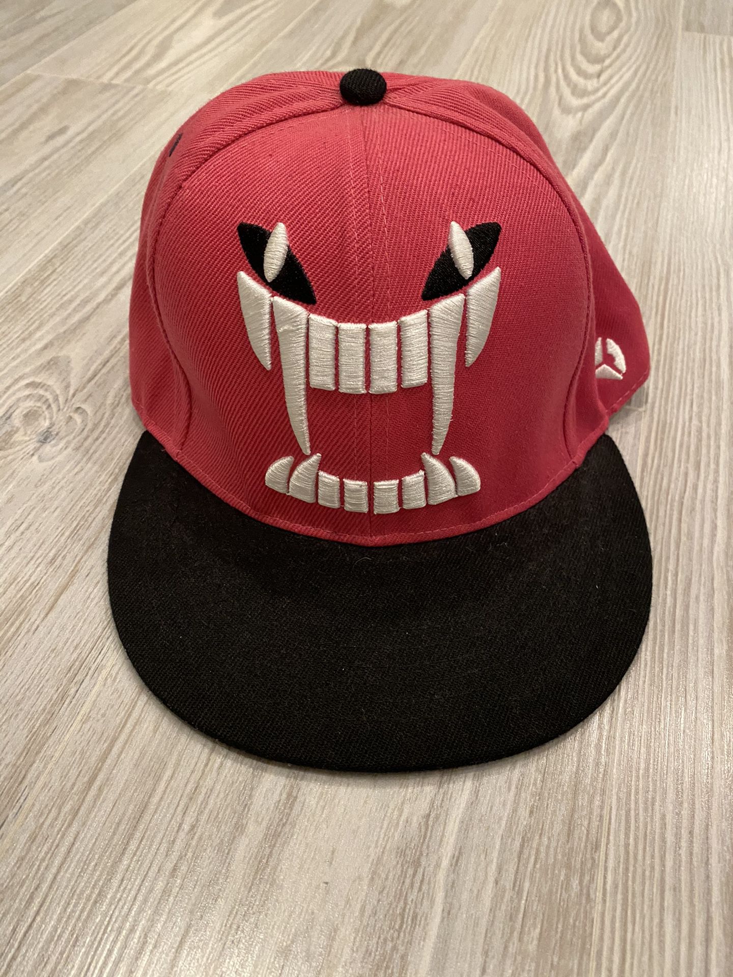 Pink angry face snapback hat cap