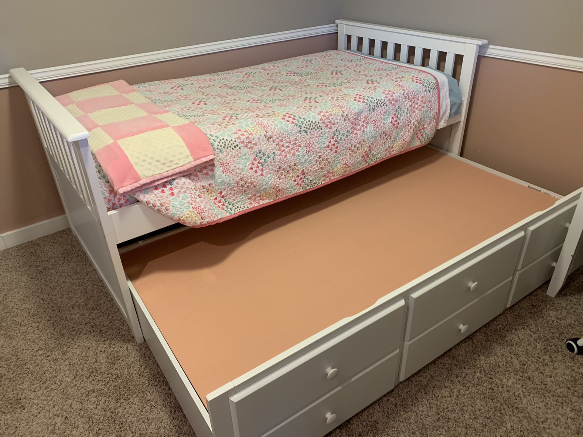 Ashley furniture “Lulu” twin over twin trundle bed with drawer storage.