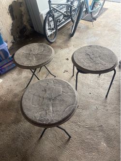 Three small cement top tables