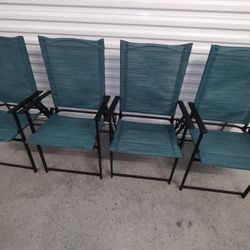 Four Green Folding Patio Chairs