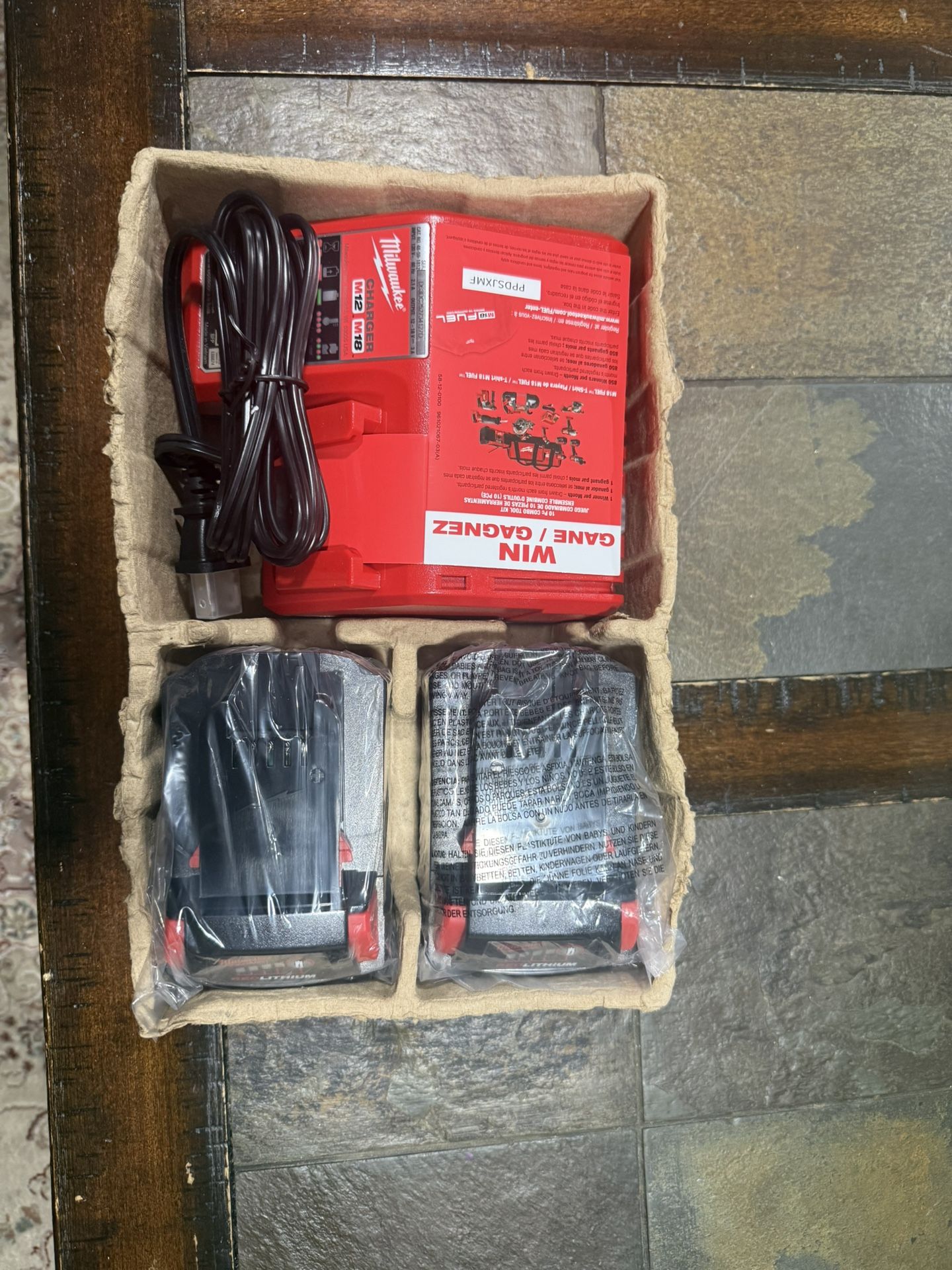  Brand new Milwaukee M18 charger with 2 Brand new 5.0ah batteries 