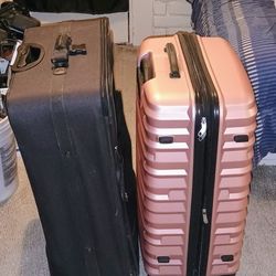 Bolso de mano para traje de American Tourister de piel sintética marrón. Y maleta negra marca PALM SPRINGS RICARDO BEVERLY HILLS DE 32X21 maleta de ma