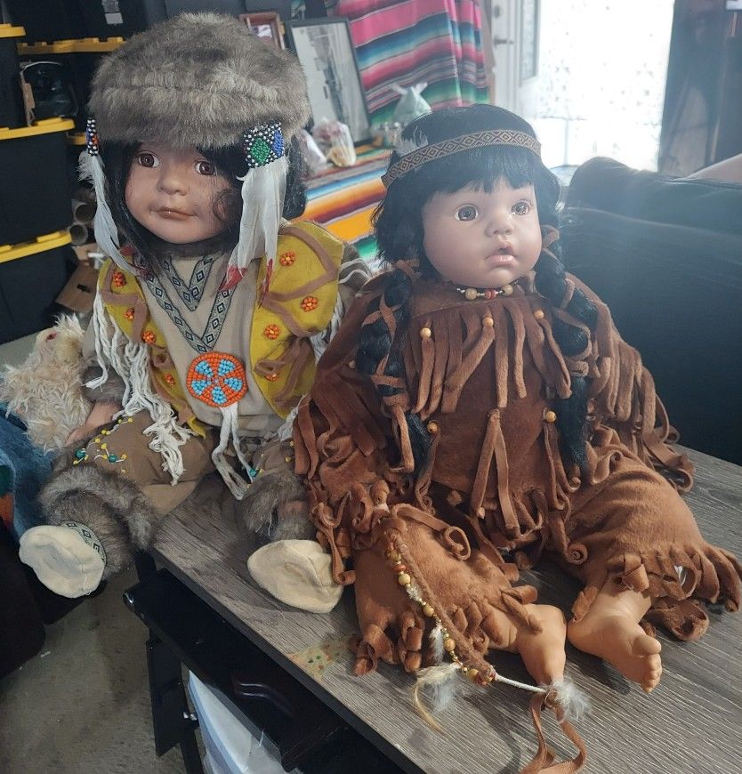 I AM Selling  These Two  Native Porcelain Dolls In Good Condition 