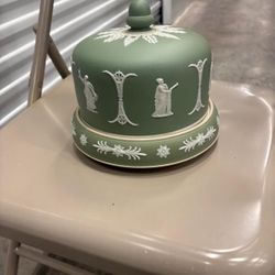 This is a Wedgwood Jasperware cheese dish, likely dating from the Victorian era around the 1870s, known for its iconic sage green 
