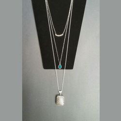 Handmade trendy long 3 tiered necklace with 3 different pendants on mismatching silver colored chains