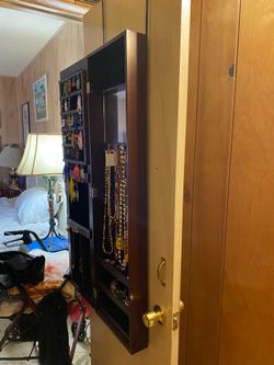 Hanging jewelry cabinet with mirror