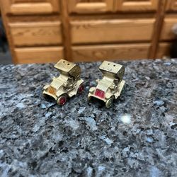 Vintage 1960s Model Roadster Pair of Salt And Pepper Shakers.  Size approximately 1 1/2 inches long.  Preowned with original cork stoppers.  