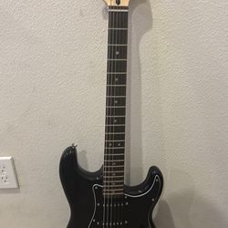 Beginner black electric guitar