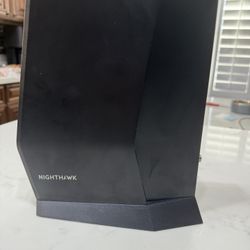 NETGEAR Nighthawk CAX30 (a DOCSIS 3.1 combo cable modem + WiFi 6 router, AX2700).