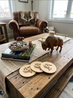 Set of Three wooden coasters featuring a stylized bison or buffalo head design