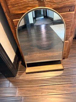 Hanging mirror with shelf