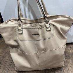 Tan large vintage Calvin Klein tote bag. Two minor peelings on faux leather.