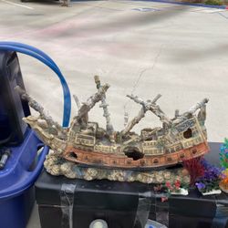I have a top fin canister filter CF 100 with all the attachments along with aquarium plant life fake, and a pirate ship along with aquarium Nick Backs