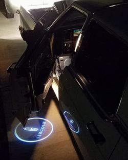 2 Lincoln universal fit Wireless projector door lights $35. Lincoln seat belt shoulder pads $40. SHIPPING AVAILABLE