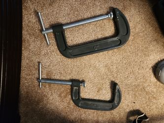 2 matching very strong cast iron clamps