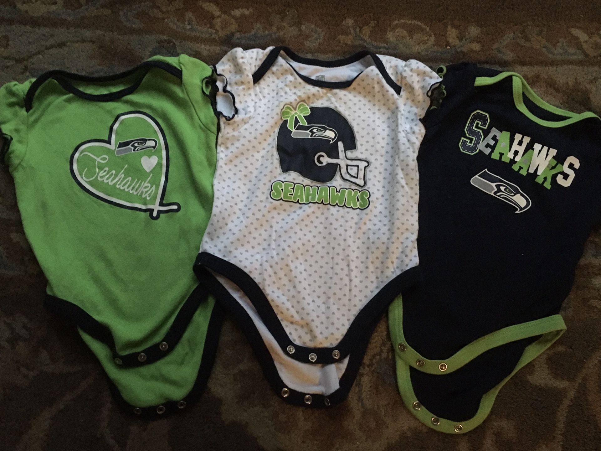 Brand new baby Seahawks onesies