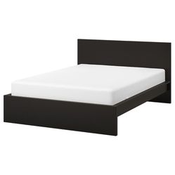 black IKEA wooden full size bed frame with headboard