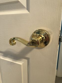 Kwikset Lido polished brass key lock door handles