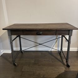 World Market  Celia Industrial Desk in a wood and metal construction with lockable casters