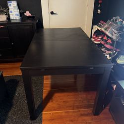 Black wood expanding dining room table