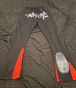 Black/red sweatpants with white lettering