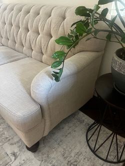 Beige tufted sofa couch