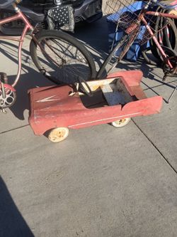 Two old Schwinn bikes and a old fire truck