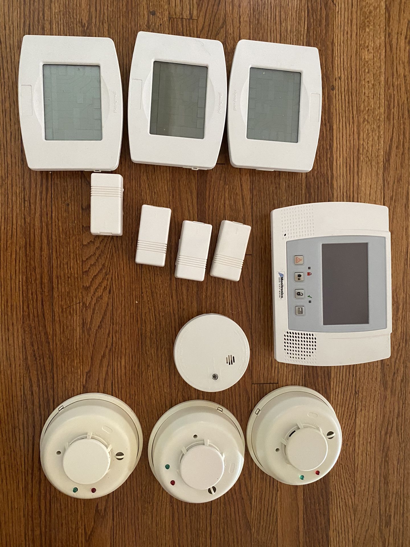 Set of thermostats, security system and smoke detectors