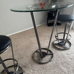 Bar Stools And Thick Glass Table 