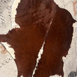 cowhide rug (roughly 5.5’x5.5’)