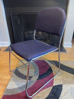 Stackable chair with chrome sled base