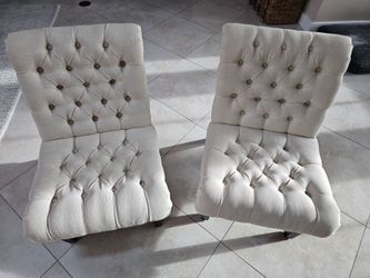 2 tufted lounge chairs
